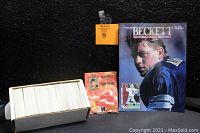 Box fully packed with NFL trading cards, sealed Badge of Honor pins pack, and Beckett Football Card Monthly magazine with Troy Aikman cover