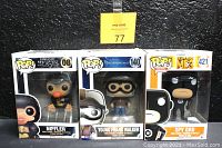 Photo of three sealed POP! vinyl figures: Niffler (Fantastic Beasts #08), Young Frank Walker (Disney Tomorrowland #140), and Spy Gru (Despicable Me 3 #421) in original packaging.