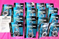 Box lot of 20 new Ultra combination padlocks in original packaging. Each lock has a 2 inch stainless steel casing with black dial plate and hardened chromile-plated steel shackle.
