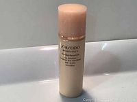 Front view of the Shiseido bottle showing the brand and product name with SPF 15 label