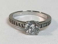 Front view of the Swarovski ring showing the round 7mm crystal center stone and crystal accented band.