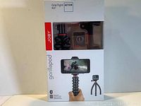 Boxed Joby GorillaPod Action GripTight Kit showing front view with flexible tripod holding smartphone and product branding.