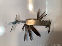 Photo of Krischler multi purpose pocket knife fully extended showing multiple tools and blades.