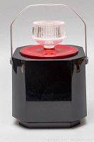 Front view of octagonal black plastic ice bucket with red lid and clear knob, metal handle up.