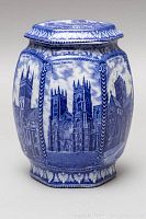 Side view of the hexagonal tea caddy showing detailed blue transferware of York Minster cathedral with borders.