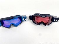 Front view of two pairs of ski goggles showing the lens color and frame details.