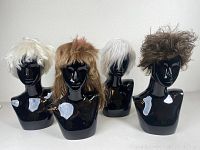Four men's wigs on black mannequin heads showing different styles and colors.