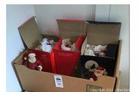 Box with Christmas figurines partially visible inside original packaging