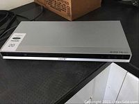 Front view of silver Sony CD/DVD player showing overall condition and design.
