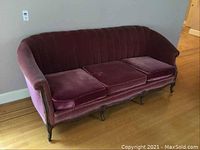 Photo A shows the sofa from a side angle, highlighting the burgundy velvet upholstery and wooden leg details.