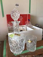 Decanter and a rocks glass with Bohemia and Czechoslovakia label visible, showing detailed cut crystal pattern and stopper design.