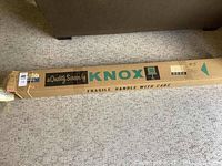 Original packaging box for Knox movie and slide projector screen with clear branding and handling instructions.