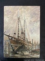 Front view of the oil painting showing docked wooden ship and artist signature.