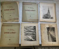Overall view of four printed book covers and six loose prints laid flat on surface showing aged condition with wear and stains.
