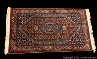 Full view of rug on black background