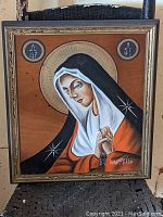 Full view of Greek Orthodox Virgin Mary icon painted on gilt wood panel in wooden frame.