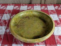 Front angle showing green, purple and gold oil spot glaze finish on the low console bowl.