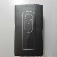 Closed retail box with white outline illustration of camera