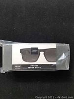 Sealed plastic bag containing Bose Frames Tenor style packaging with printed label