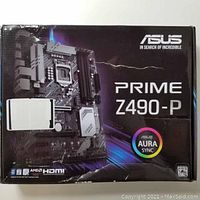 Closed retail box for ASUS Prime Z490-P showing branding, model and features logos: Aura Sync, HDMI, AMD Crossfire.