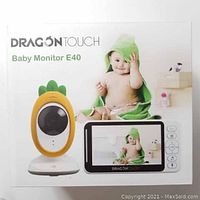 Box showing Dragon Touch Baby Monitor E40 with baby image and product features.