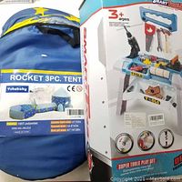 Photo showing packaging of rocket 3-piece tent made by Yuhebaby detailing fabric type and size specifications.