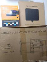 Retail boxes for Roku Premiere 4K streaming device, digital HDTV antenna, and Perlesmith PSLFK1 TV wall mount