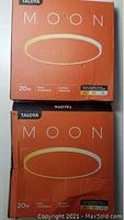 Two boxed Taloya Moon 20W surface mounted light fixtures in original packaging showing branding and product details.