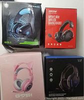 Four boxed gaming headsets from Mpow, Phoinkas, Bluetooth, and Stincoo.