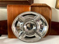 Two rectangular vintage teak wood trays and one round stainless steel tray visible with compartment divisions.
