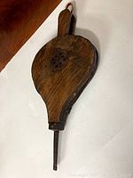 View of the bellows showing wooden body and metal vent on the front face.