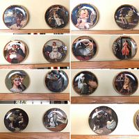 15 collector plates arranged on a wall, various Norman Rockwell scenes, all have plate hangers, no visible damage