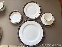 Overview showing a dinner plate, salad plate, cup and saucer to illustrate pattern and included items
