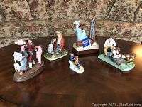 Porcelain figurines collection from front view showing five distinct items
