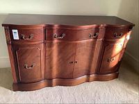 Front view of buffet showing overall design and handle configuration