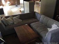 Overall view of assembled two-piece sectional couch in room