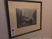 Overall full view of the framed signed print on the wall, showing the mat and frame.