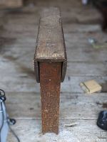 Side view showing the thin profile of the drop leaf table with one leaf down