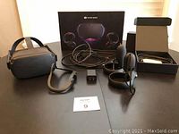 Full contents including headset, controllers, link cable, power adapter, open accessory box and original packaging