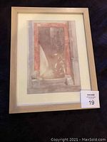 First framed watercolor showing a doorway and potted plant in a solid wood frame