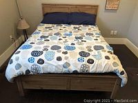 Full assembled bed frame with mattress and bedding