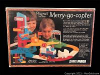 Box front showing vintage Playrail Merry-go-copter toy train set by Parker Brothers with images of children playing and product details