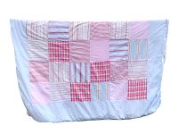 Full front view of the patchwork duvet cover showing a variety of pastel fabric squares sewn together predominantly pinks, reds, and light blues.
