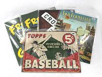 Group photo of all 5 metal signs, showing their packaging and designs.