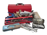 Photo of red tool box, large red tray, blue and silver tool boxes with assorted tools including wrenches and pliers, all arranged on the floor