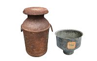 Photo showing full view of rusty metal milk can and galvanized creme strainer funnel with label