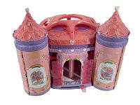 Front view of pink and purple plastic castle with two towers and central door, featuring rainbow and garden decals.