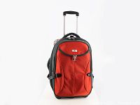 Front view of red Hayes rolling suitcase showing the dual zipper front pocket and expandable zipper section at side.