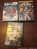 Photo of three PC game cases: Spore, Star Wars Battlefront, Fallout 4 G.O.T.Y.
