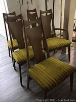 Five chairs arranged in two rows, showing front and side profiles